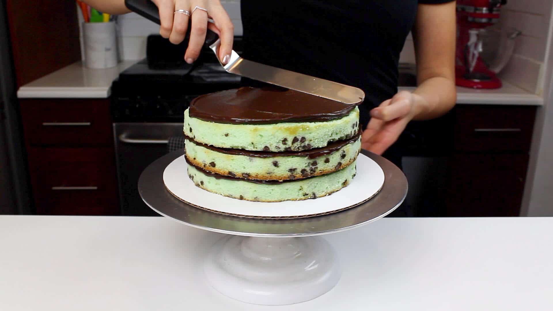 spreading ganache onto layers