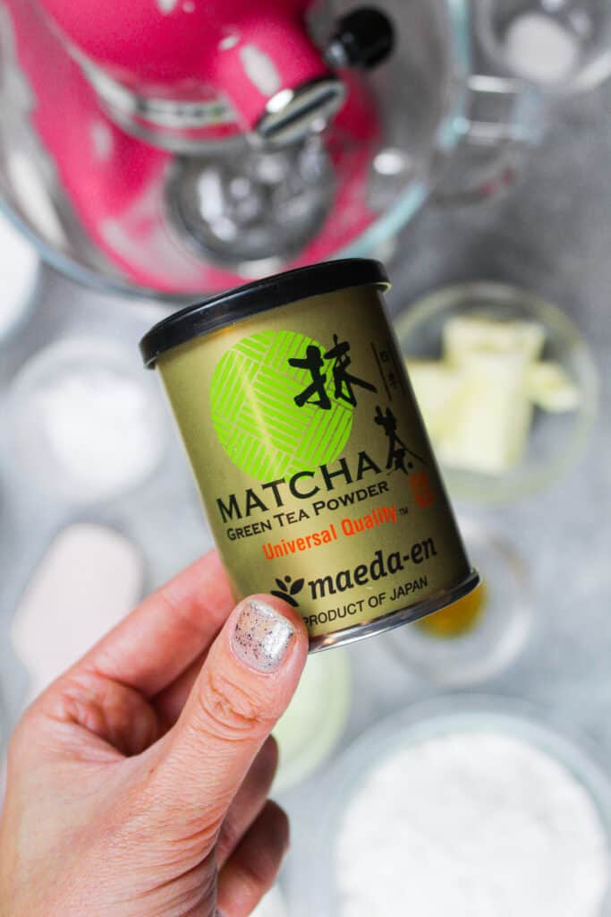 image of matcha powder in hand to make a  matcha cake