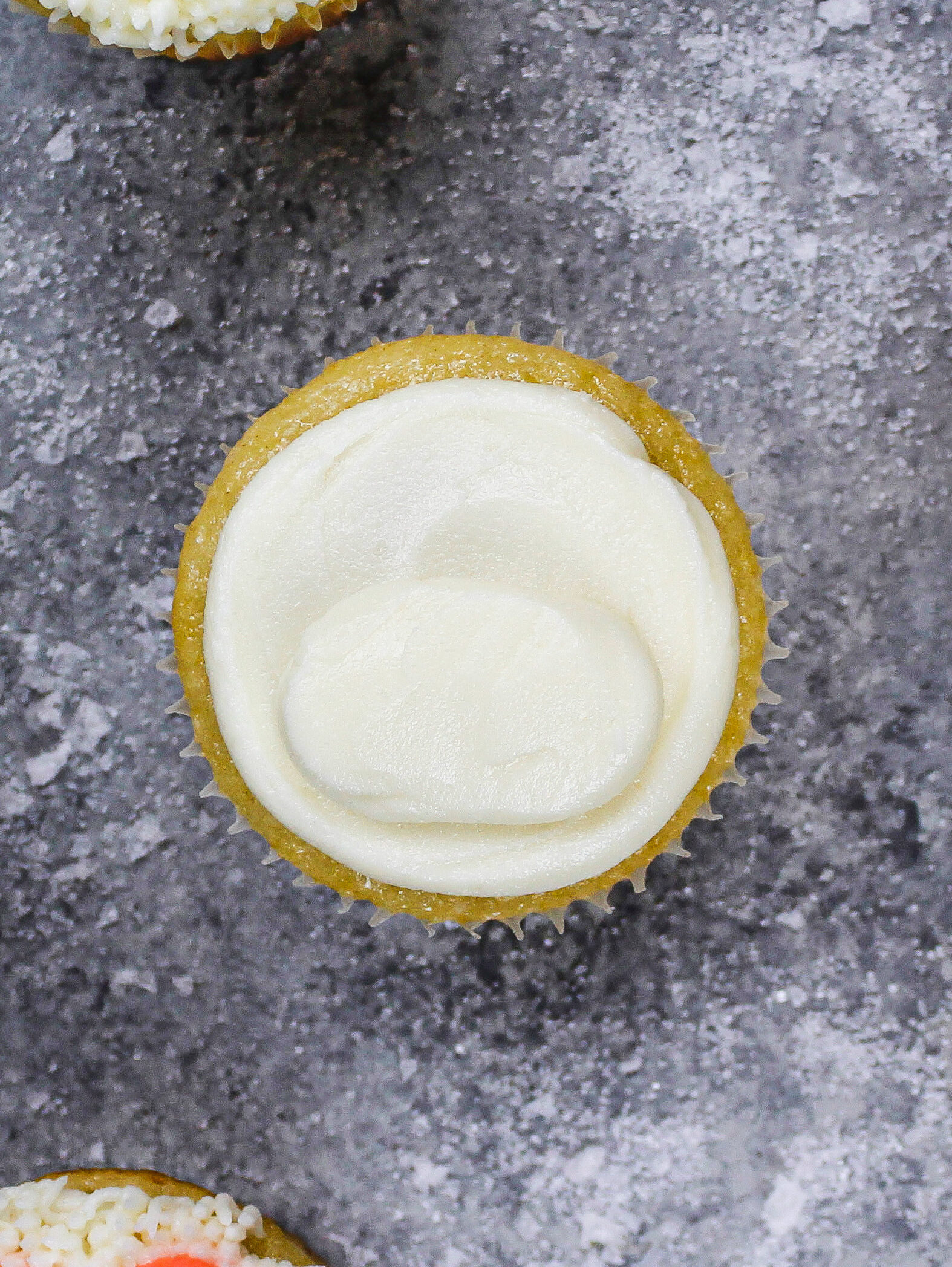image of a cupcake with a mound piped on the bottom of it to look like a polar bear's snout